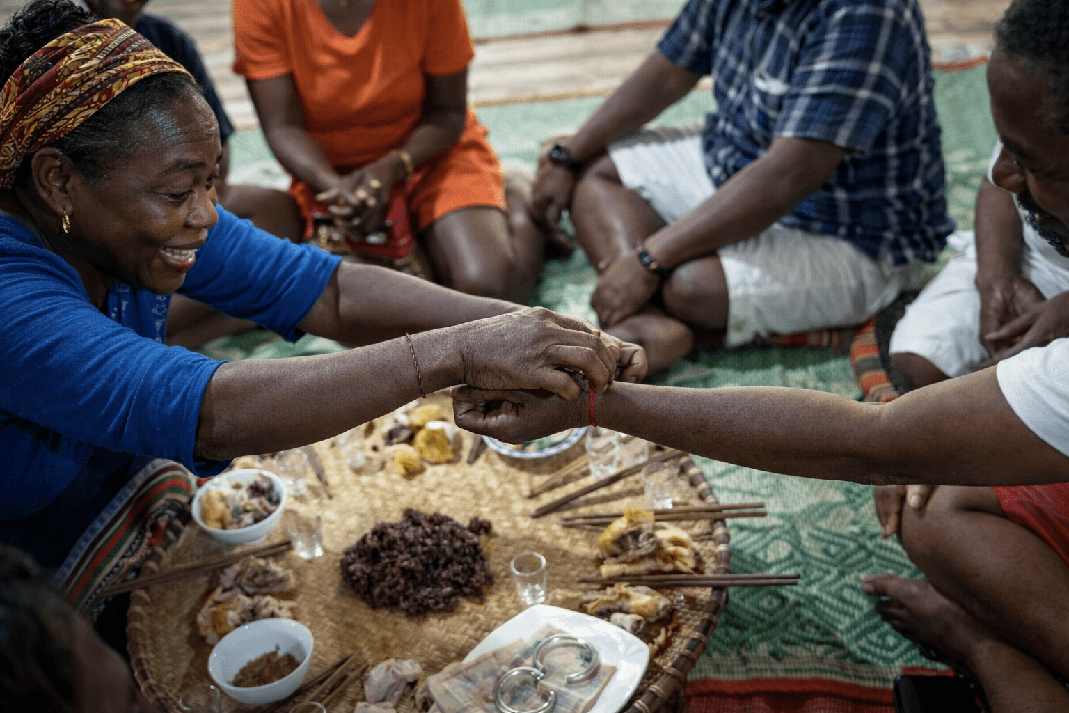 Hands preparing a shared meal