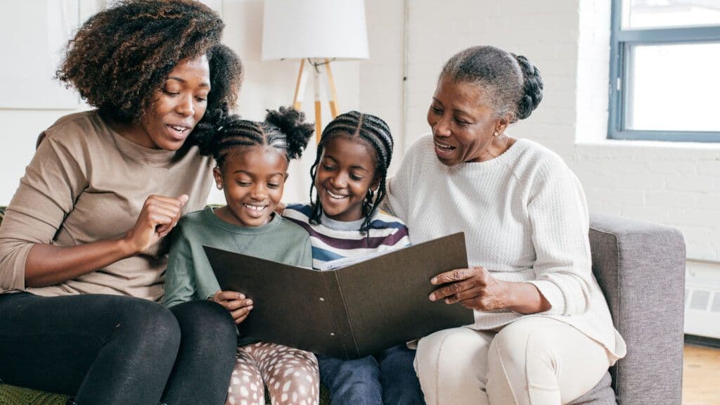 Elder sharing stories with younger family